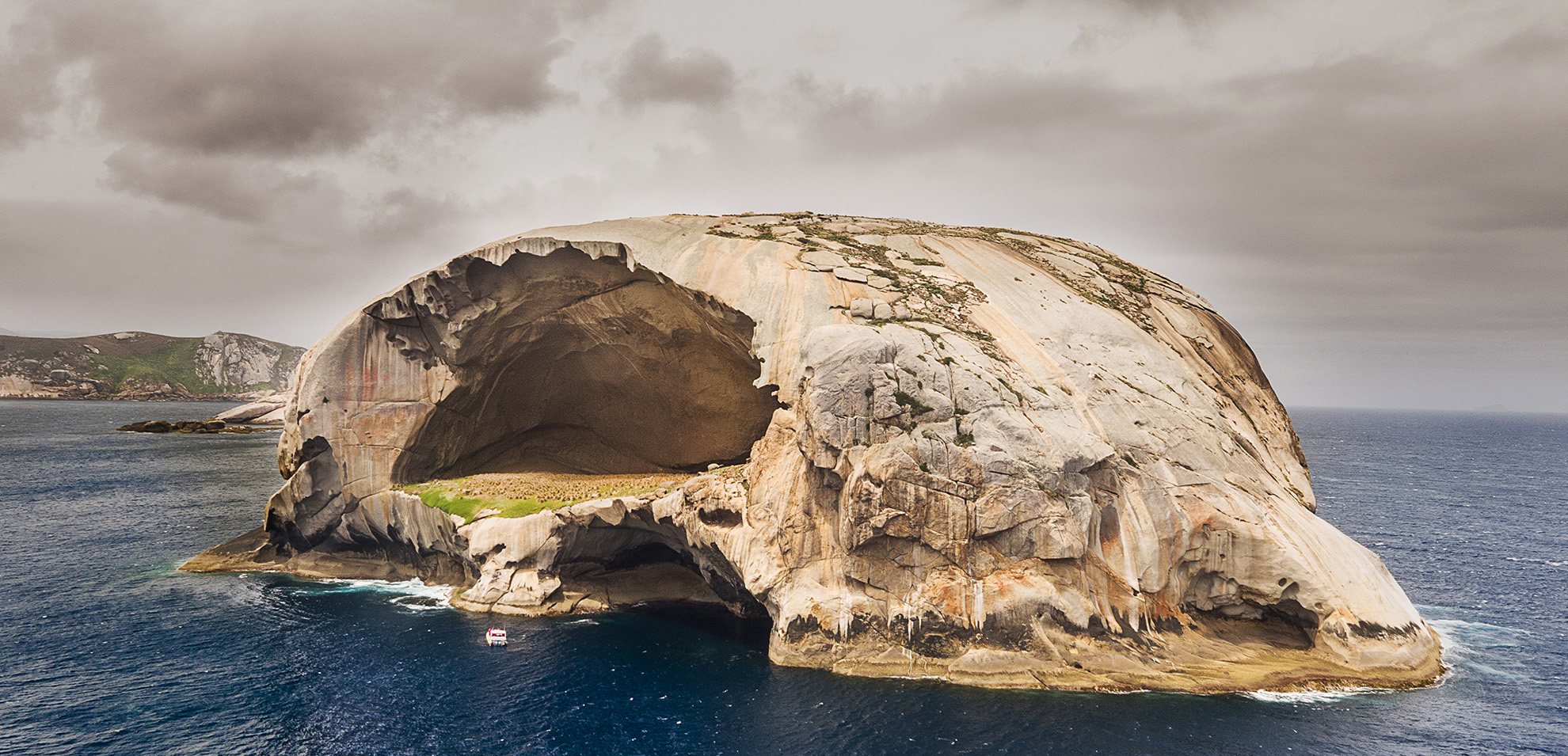 The haunting skull-like silhouette of Cleft Island serves as a natural sentinel for the Wilsons Promontory coastline and its surrounding marine park.